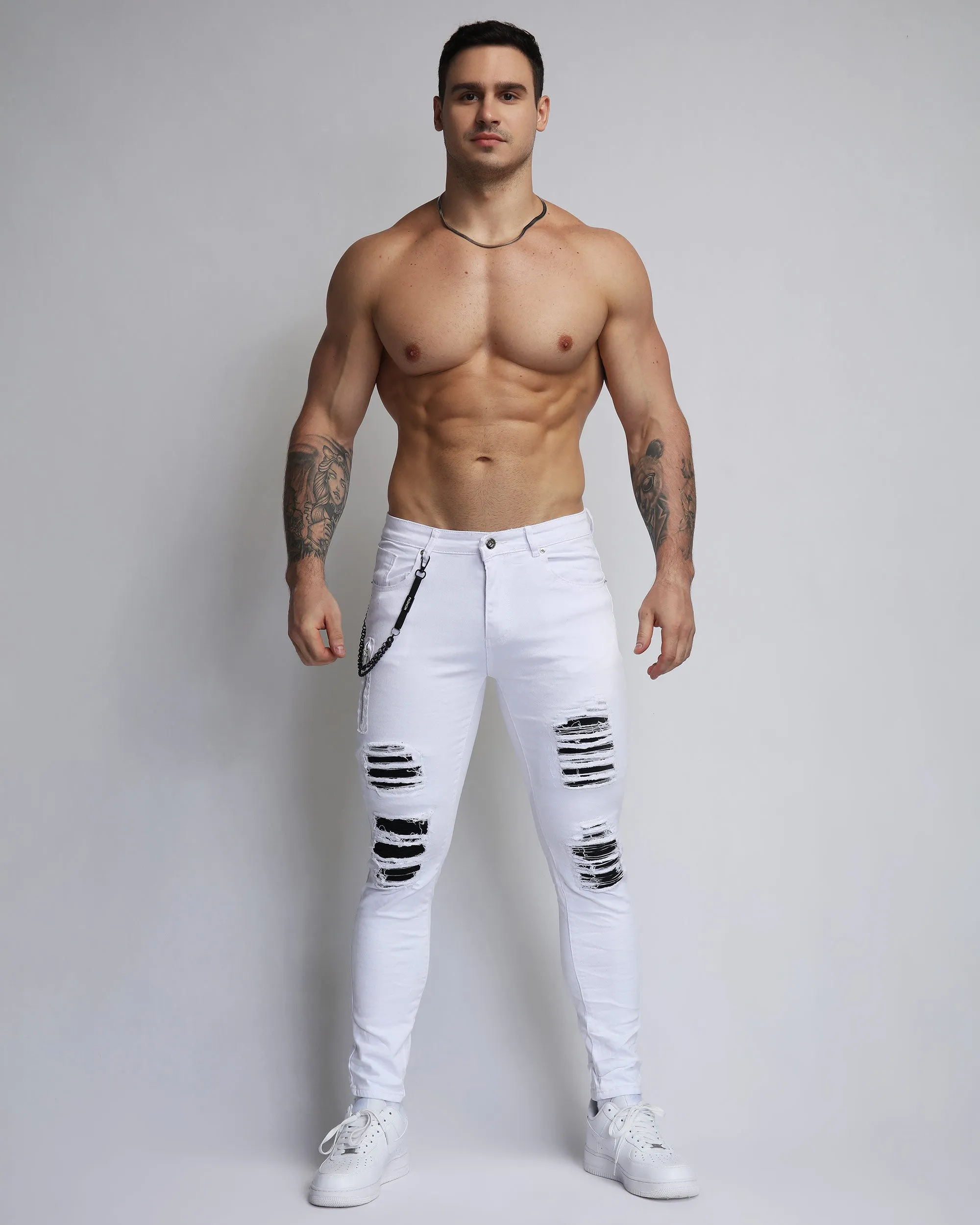 Large Ripped White Jeans with Black Patches